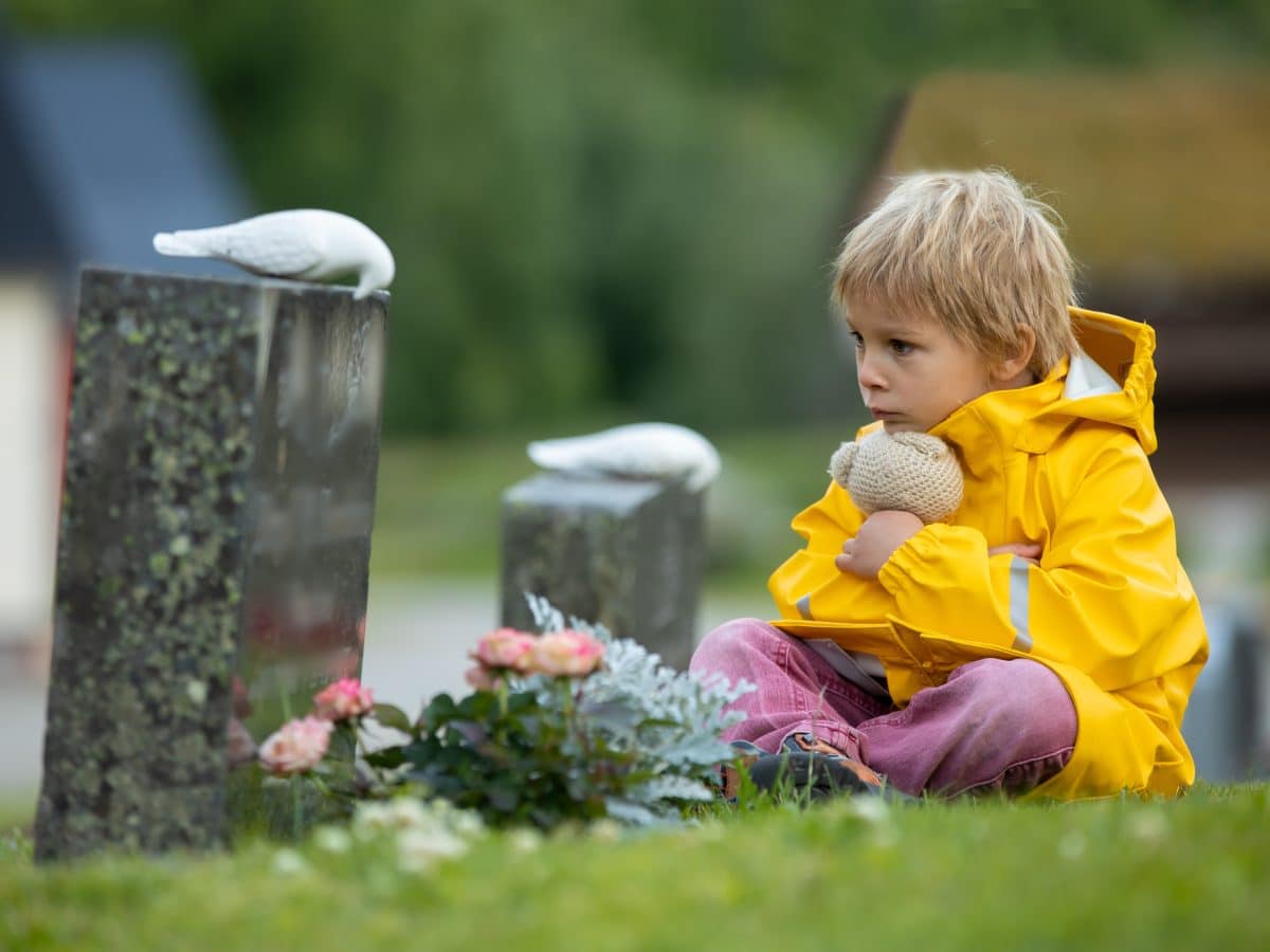 Sad,Little,Child,,Blond,Boy,,Standing,In,The,Rain,On