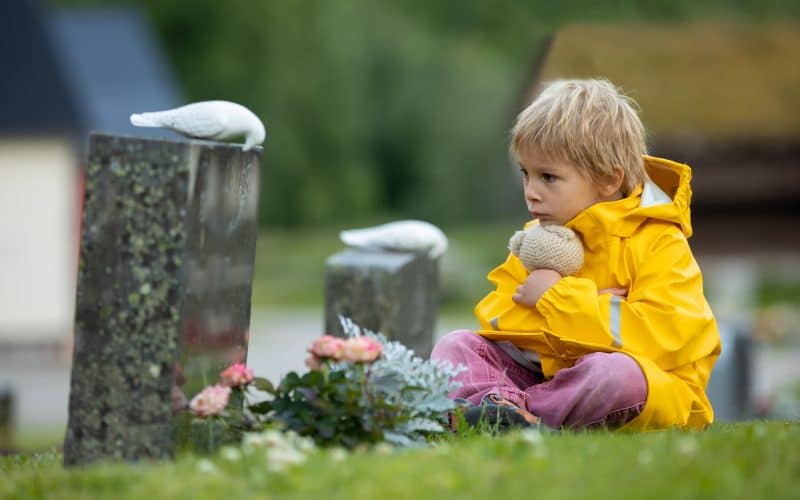 Sad,Little,Child,,Blond,Boy,,Standing,In,The,Rain,On