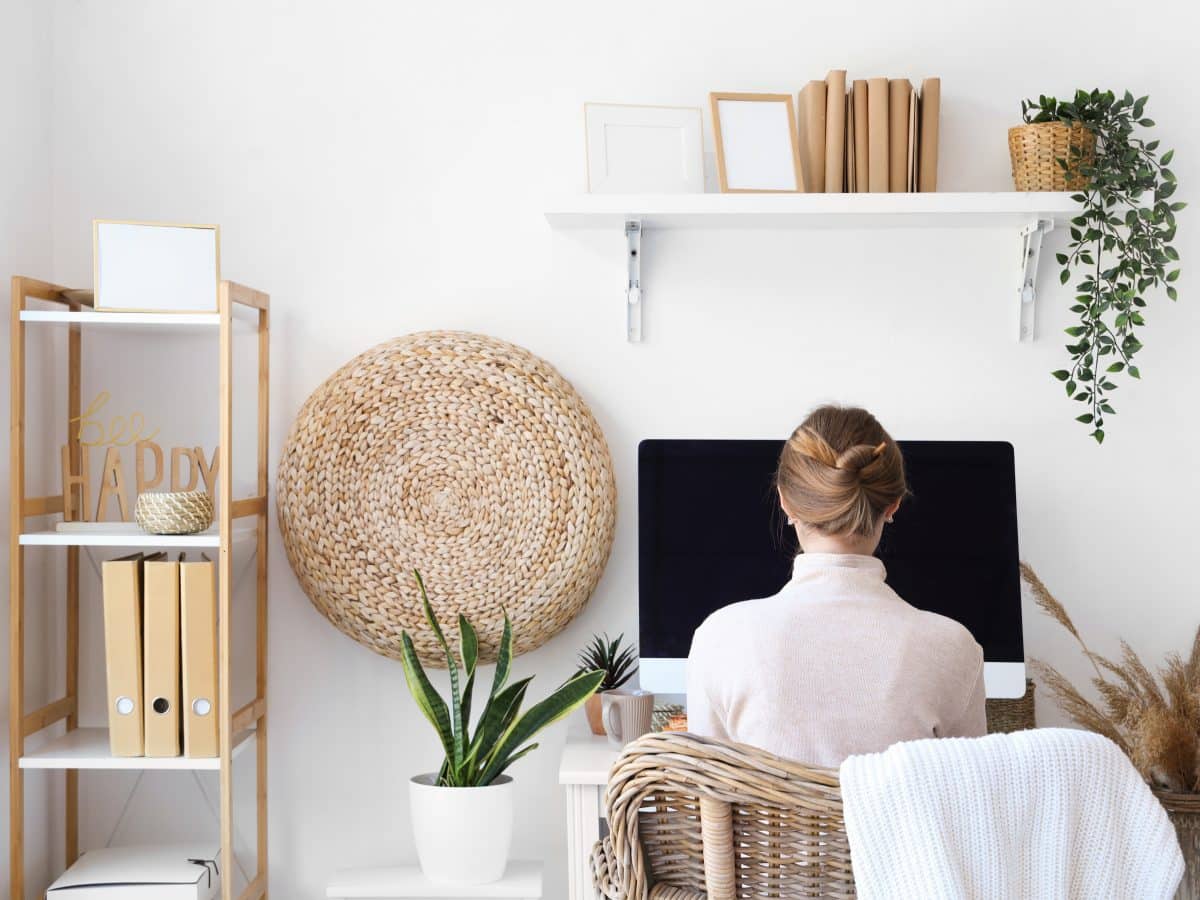 Young,Woman,Sitting,At,Workplace,In,Office,,Back,View