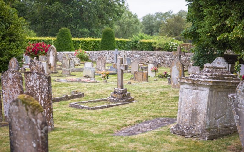 Old,English,Cemetery,With,Weathered,Gravestones,Covered,In,Moss,And